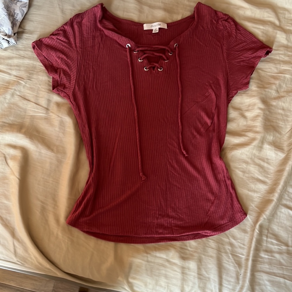 Maroon/ rosewood colored to. Stretchy material, hugs, all the right places!